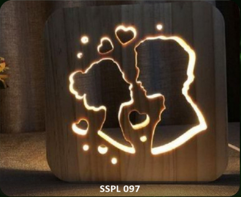 Wooden night light with a couple silhouette and heart design, brand 'SSPL' visible.